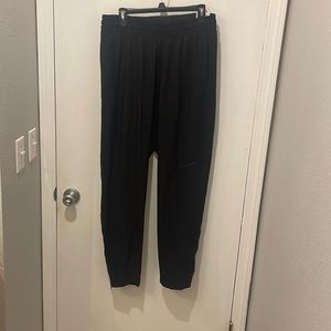 Nike athletic pants. Brand new! Tapered at bottom with zippers